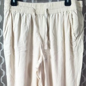 Wonderly joggers, lightweight material, tie waste, light pink color, size large.